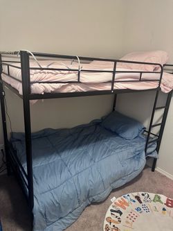 Unused bunk bed with mattresses included