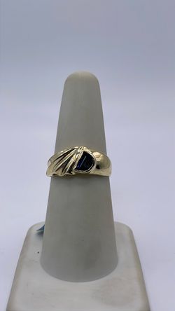 10k gold ring with dark blue CZ