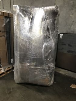 Gray sofa / chaise . Still in the wrap. NEW!