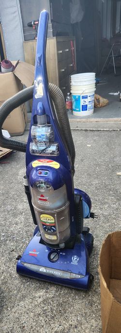 The item in the image is a Bissell Rewind SmartClean Upright Vacuum, likely model 58F8-3. 
Cleaning Width: 15-inch cleaning path.
Motor: 12 amp motor.