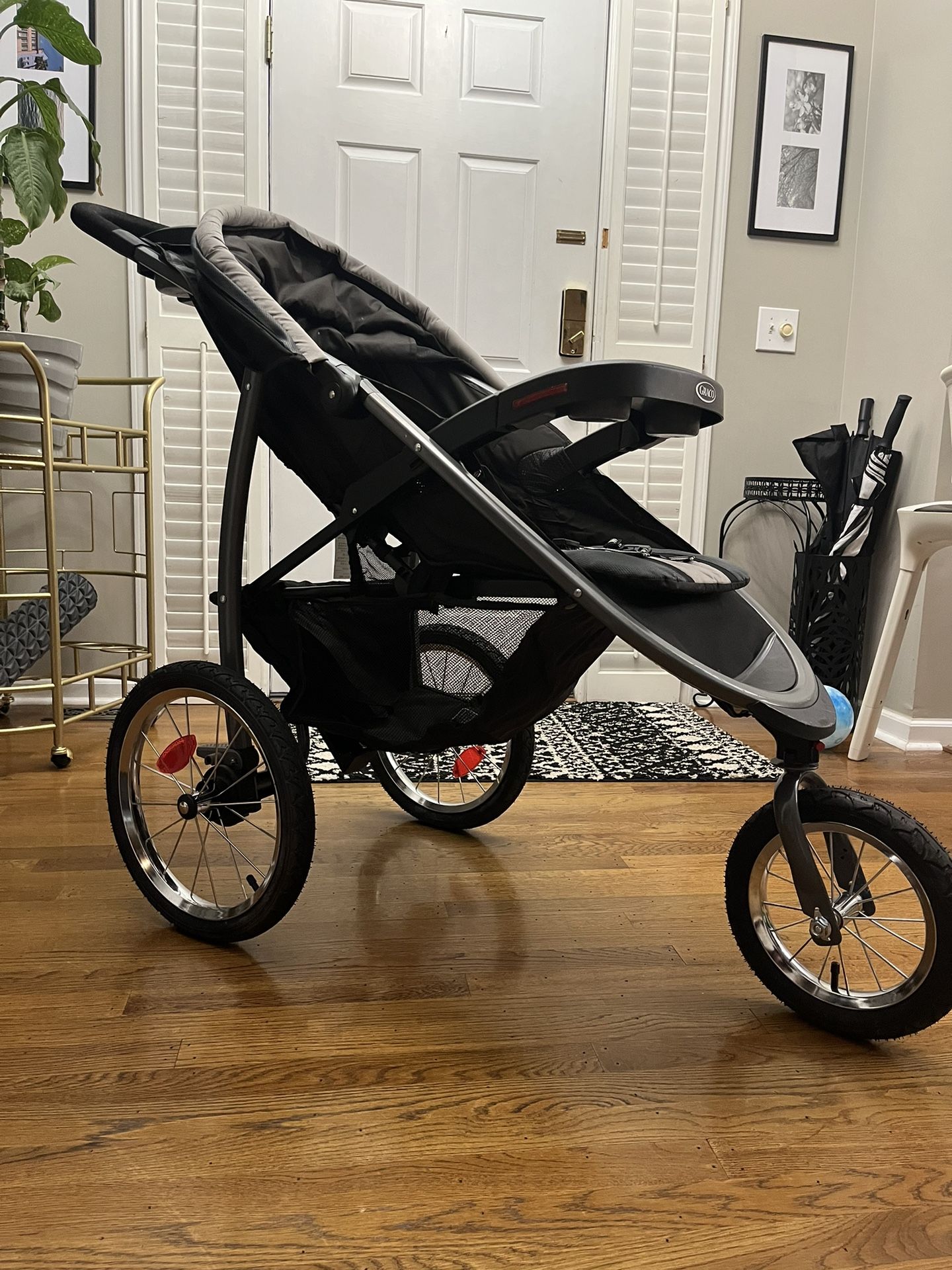 Graco FastAction Fold Jogger Travel System | Includes the FastAction Fold Jogging Stroller and SnugRide 35 Infant Car Seat, Gotham