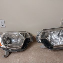 headlights for toyota tacoma 2015 OEM $95 For both Obo
