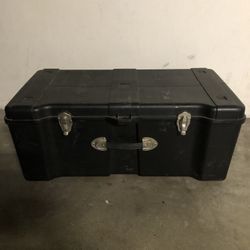 Rugged plastic storage trunk with latches