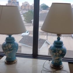 Pair Blue Porcelain Ginger Jar Lamps With White Raised Floral Design $100obo.