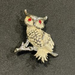 Vintage Owl pin with Ruby color jeweled eyes. 1-1/2” length.