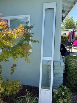 8 foot sliding door panel with small doggy door