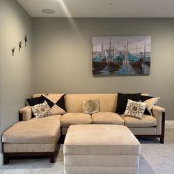 L-shaped tan suede couch