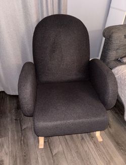 Gray cushioned rocking chair