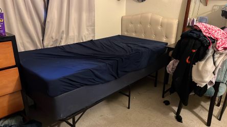 Clean twin size bed with box frame