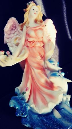 Angel with dolphins Statue