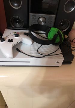 Xbox one with battery charger and a pair battery extra