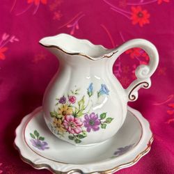 Vintage Miniature Gold Trimmed Floral Pitcher with saucer.