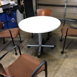 36” Round Table On Casters With 4 Wood Stackable Chairs 