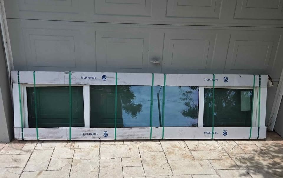 Brand New 95"W x 23"H PGT Sliding Window.