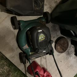free lawn mower, push mower, and four 4 gas cans