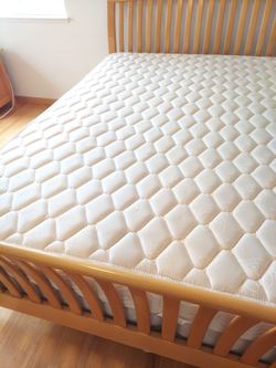 Cal king almost new mattress /box spring set solid  coil construction firm not rock hard ones. Steal the deal since moving. Always covered many layers