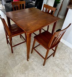 Wood high-top table with four chairs for sale !!