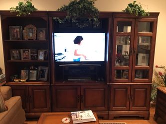 3 piece wall cabinet. Bought from Bassett and in excellent condition. Pictures will be removed. 300.00. Will negotiate. Too large for the spot I have