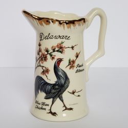 Delaware souvenir pitcher featuring art work by D. Rudeman, Blue Hen Chicken