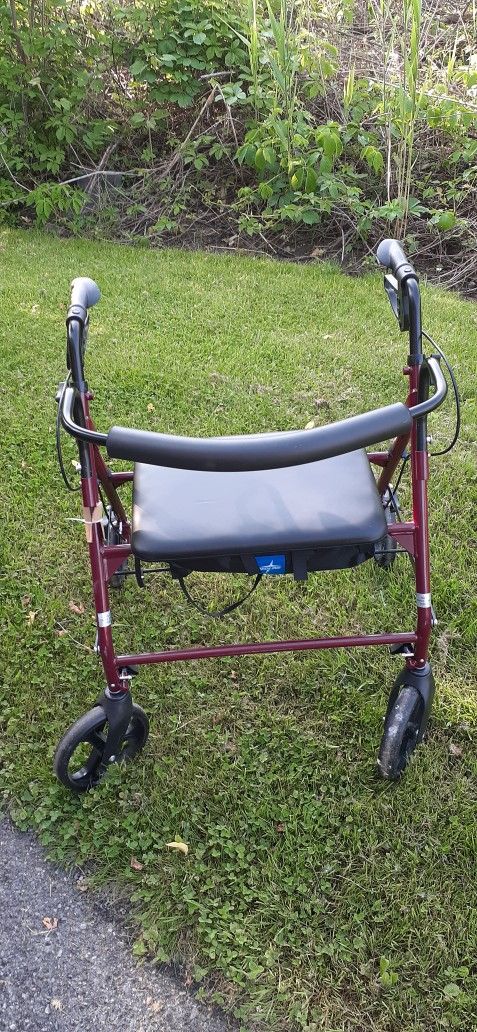 ADULT SIZE WALKER WITH WIDE SEAT AND STORAGE SPACE BELOW SEAT..CLICK ON PICTURE YOU WILL GET FULL PICTURE SIZE