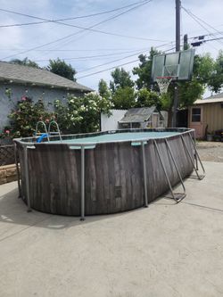 Pool with ladder and filter pump