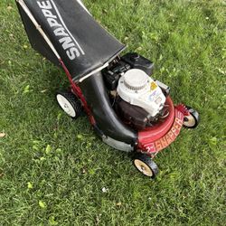 Snapper 2 cycle lawn mower, older or vintage mower.