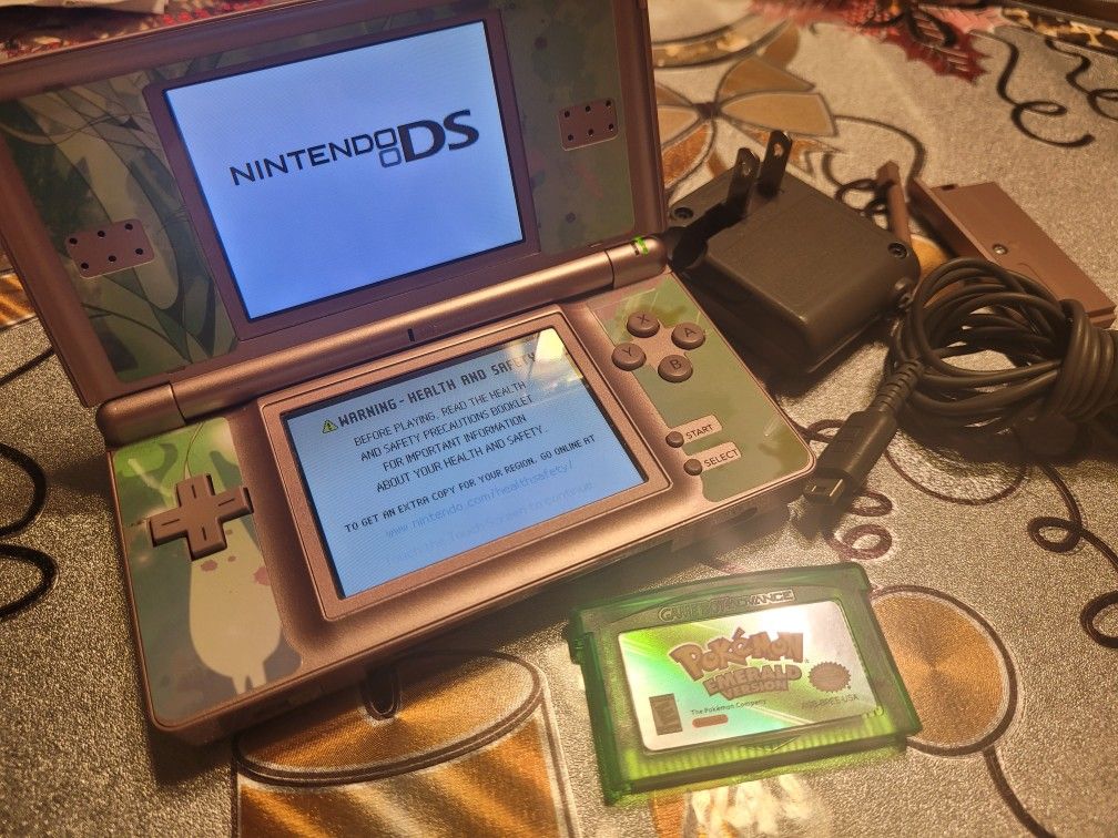 NINTENDO DS LITE WITH CHARGER AND ONE GAME INCLUDED