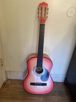 Pink acoustic guitar