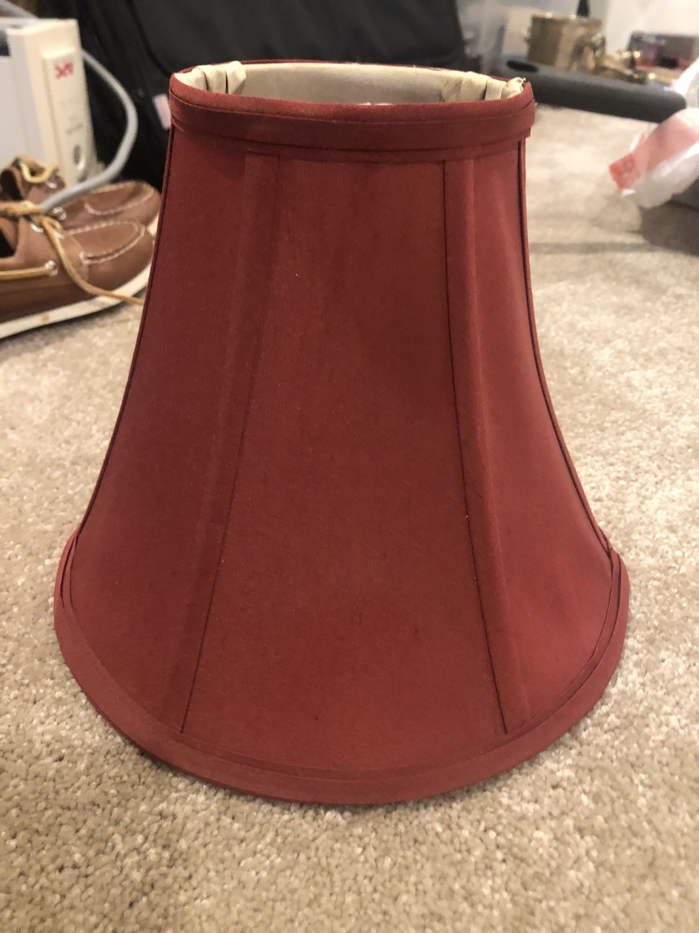 Lamp shades qty 2 Rust color. Top opening in 4”. Bottom opening is 9”x9”. Great condition