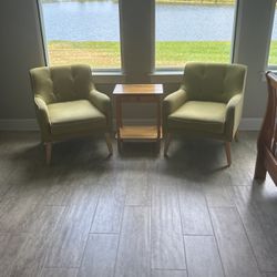 2 Green Chairs With Wooden Table