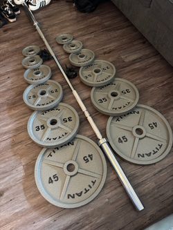 TITAN OLYMPIC WEIGHTS WITH 7 Ft 45 lb barbell 2x45, 2x35, 2x25, 2x10, 2x5 and 2x2.5 lbs with collar locks included