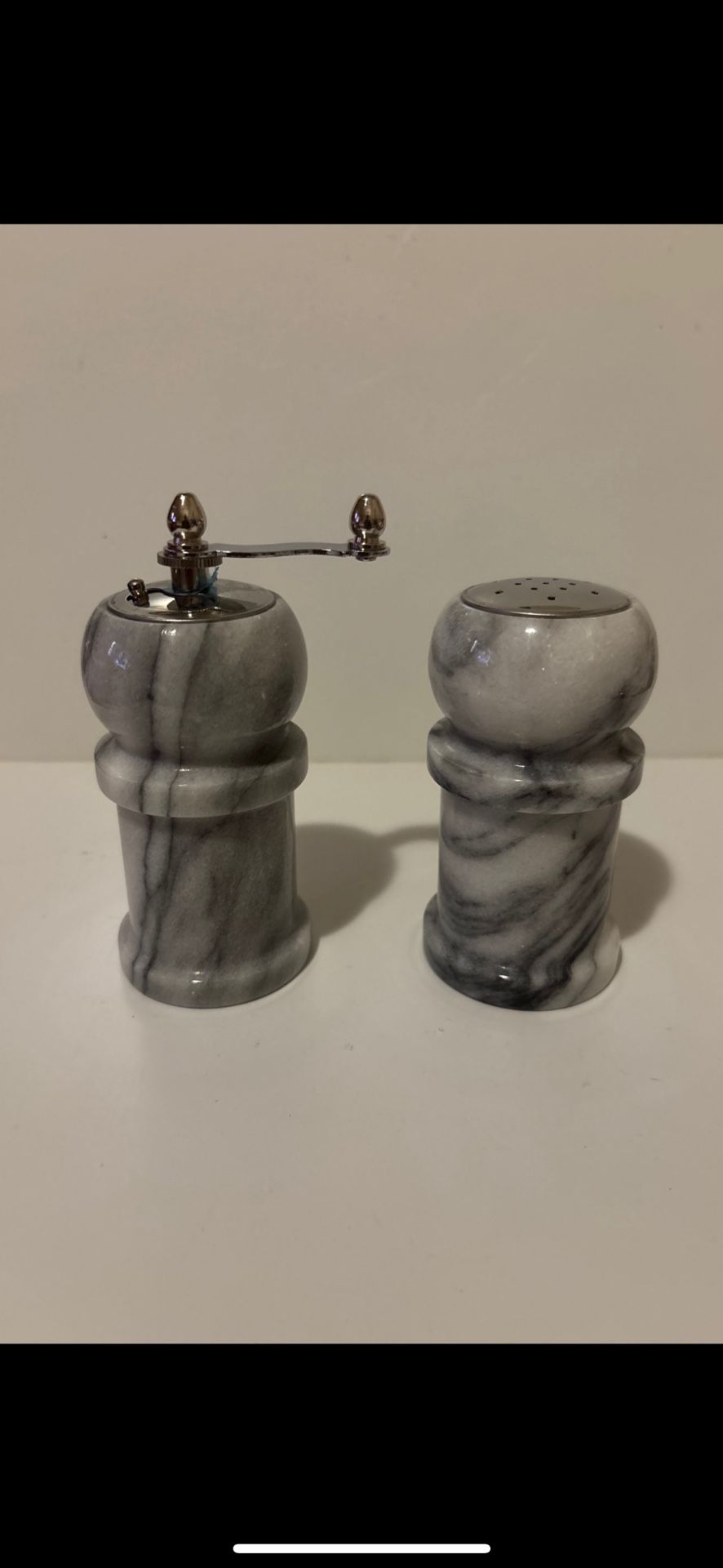 Marble Salt and Pepper Shakers. Pepper is 4.75 inches. Salt is 4 inches.