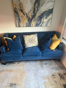 Blue couch, chair and ottoman