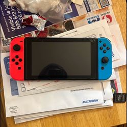LIKE NEW NINTENDO SWITCH V2 OLED W/GAMES