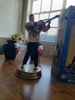 Animated Elvis Presley dancing figurine