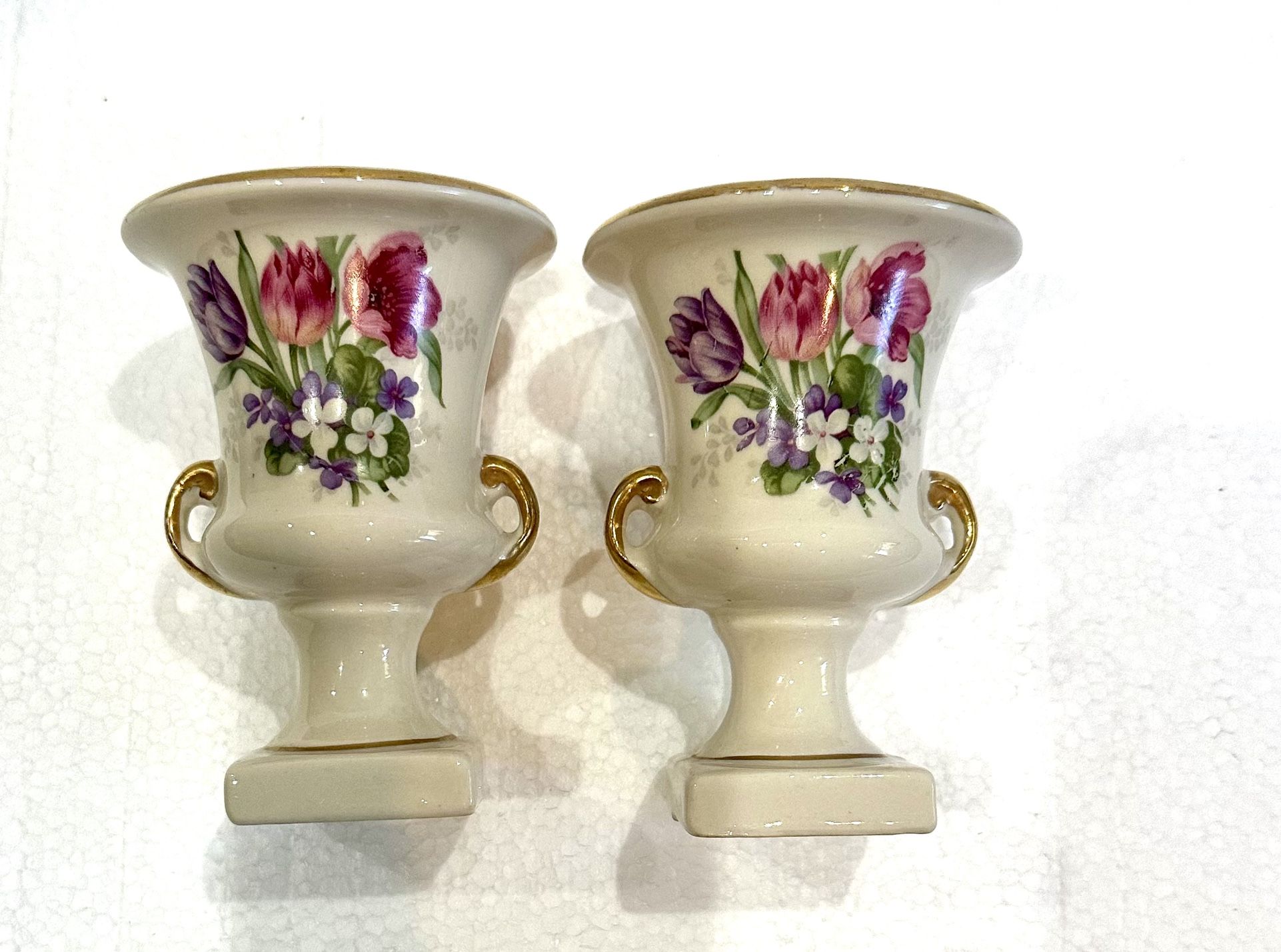 Vintage porcelain footed /candle holder w/gold trim. 4/12 inches