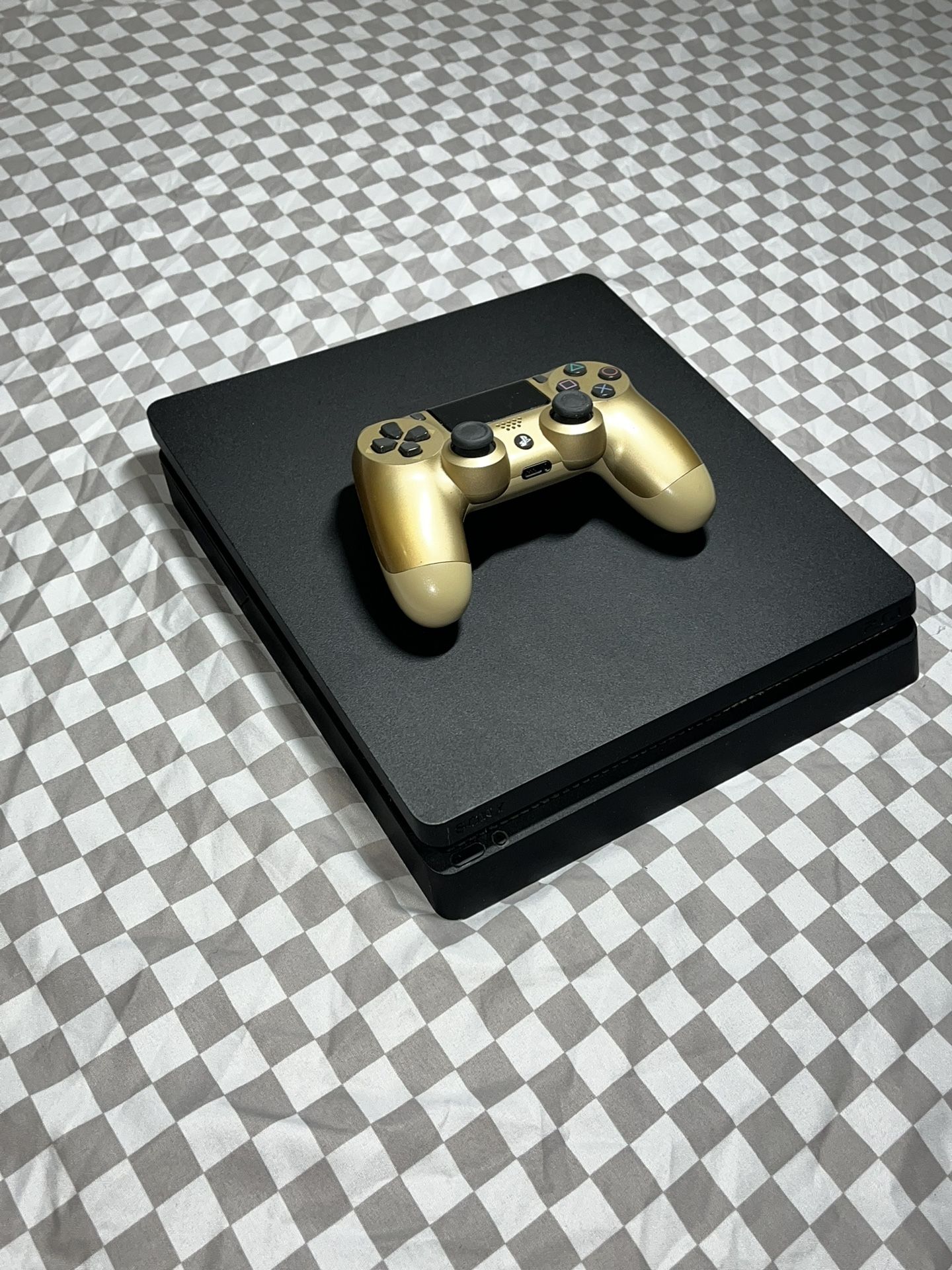 Black PS4  and Gold DualShock Controller