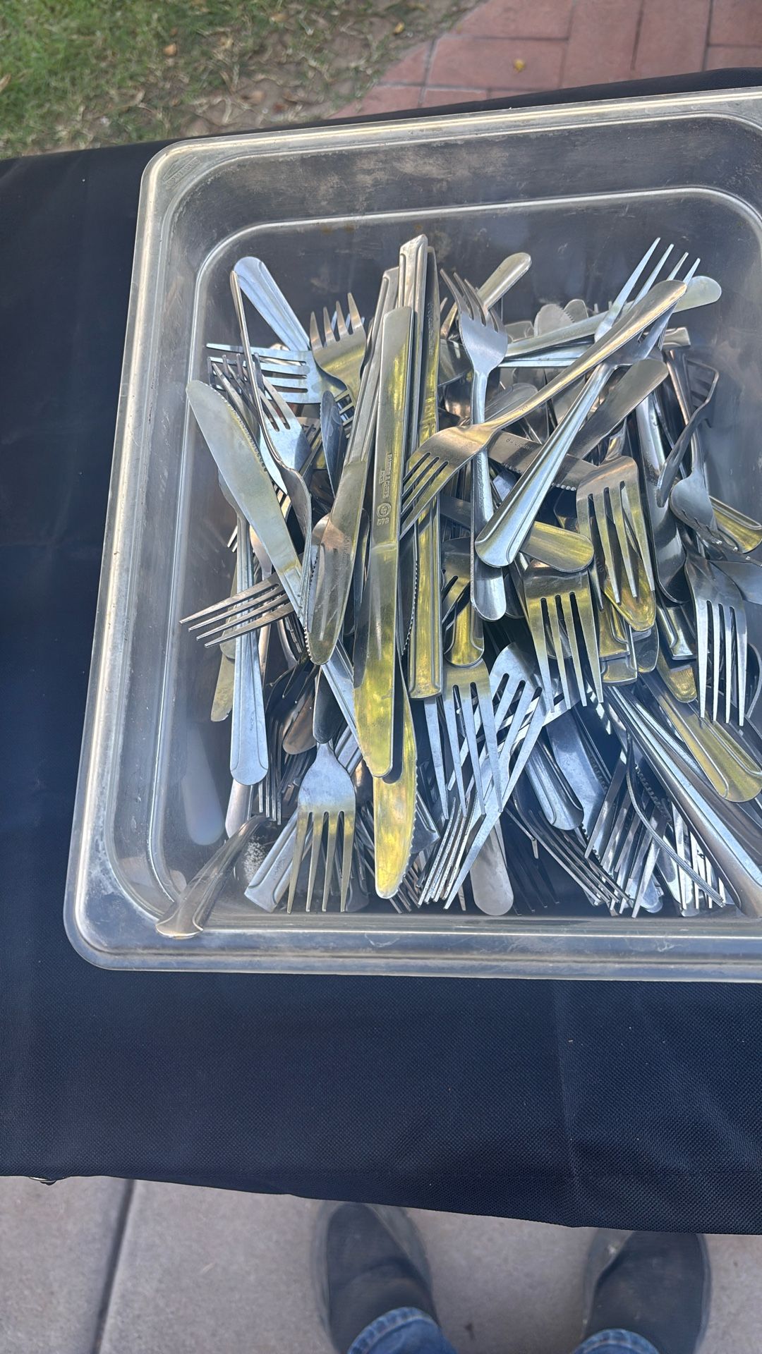 Approximately 100 pieces of knives and forks