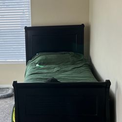 wooden bed and full-size mattress