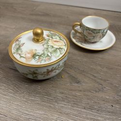 Hand painted porcelain tea cup and sugar bowl