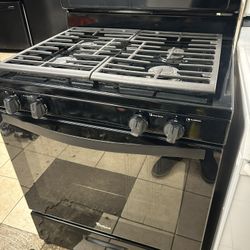 Black Fridge And Gas Stove