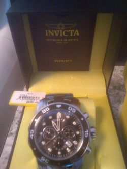Silver men's Invicta watch. Offers starting at $155