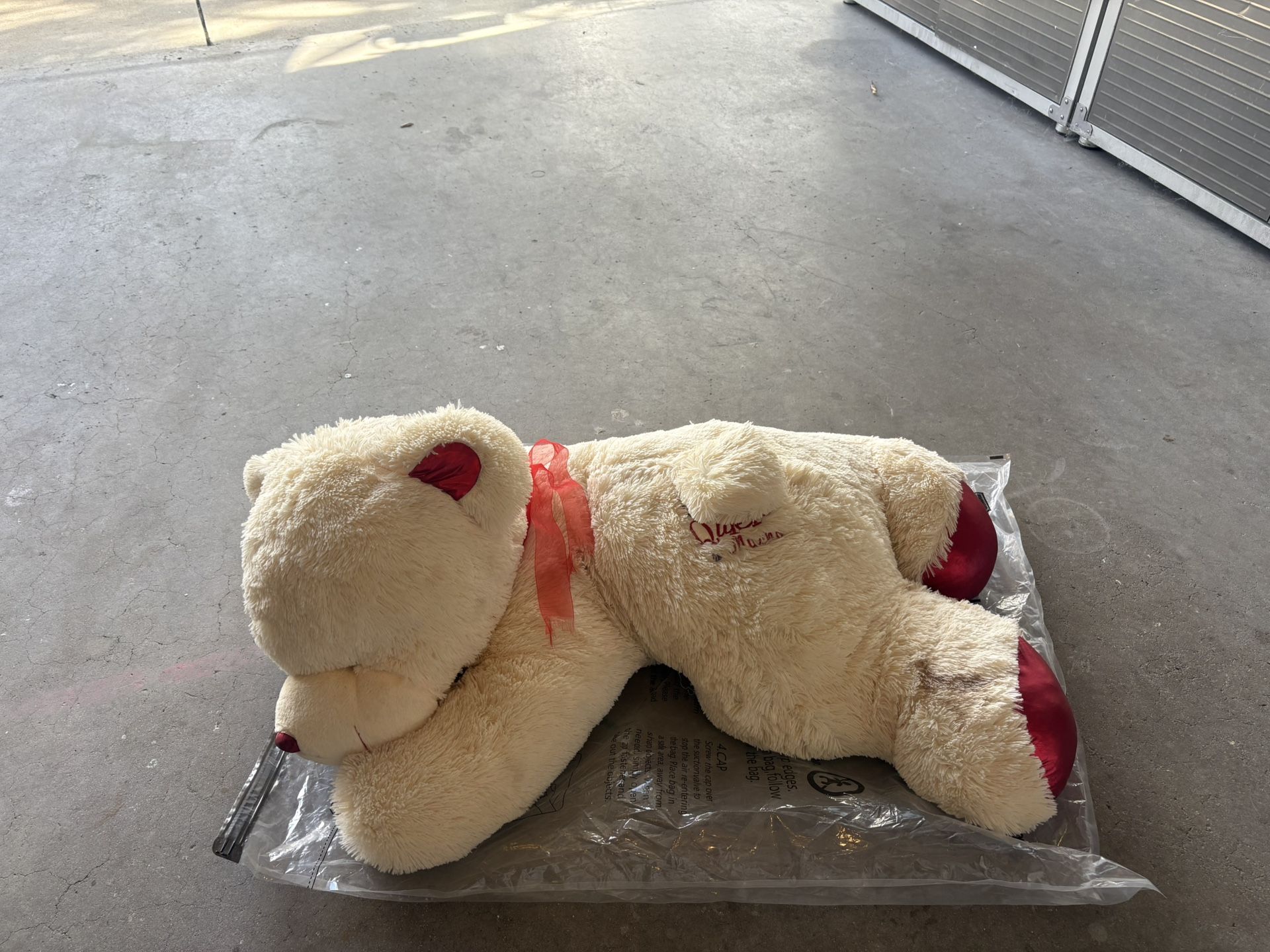 Large Plush Teddy bear Sleeping W/ “te quiero mucho” words on the belly