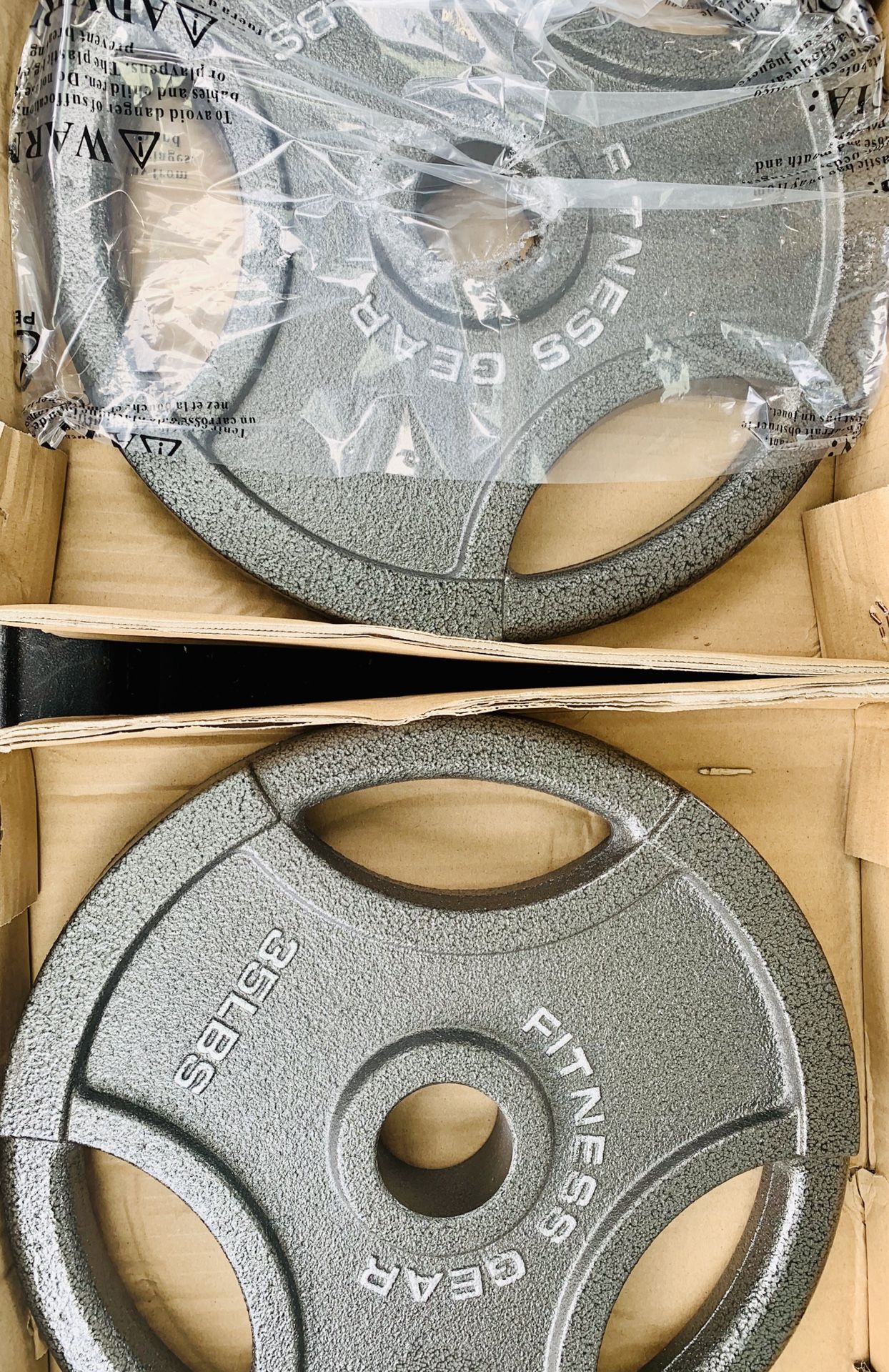 NEW SET OF 35 lb OLYMPIC PLATES