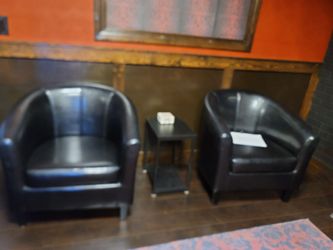 Dark leather  bucket chairs
