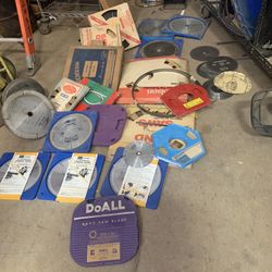 LARGE QUANTITY OF RADIAL AND BAND SAW BLADES  195$ TAKES ALL!