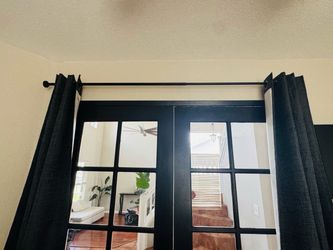 Curtain and black metal pole
