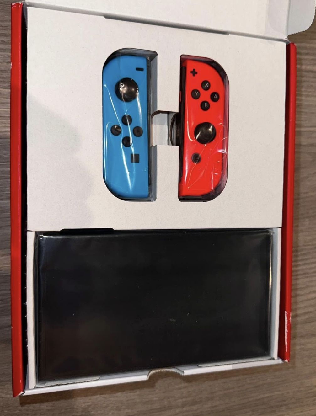Nintendo Switch OLED with Neon Blue and Neon Red Joy‑Con