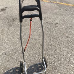 A PORTABLE HAND CART WITH BUNGEE CORD LITE WEIGHT AND STURDY FOLDS FLAT $20.00