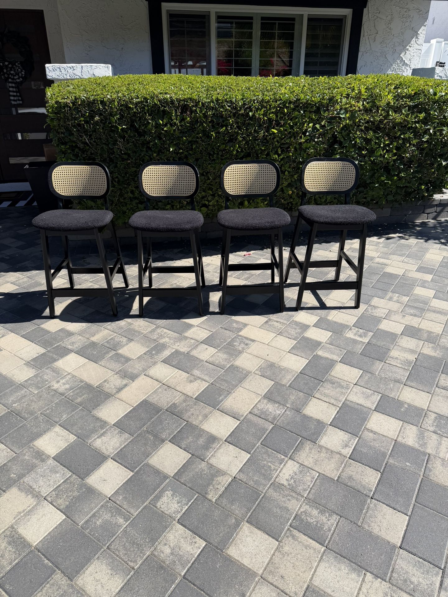 Set of Four Modern Black and Rattan Bar Stools